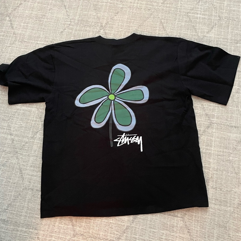 Stussy Kids Black Tee with Green and Blue Floral Design